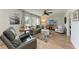 Comfortable living room with hardwood floors, plush seating, and bright natural light, perfect for relaxation at 5207 5Th Avenue Nw Dr, Bradenton, FL 34209