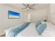 Bedroom with ceiling fan, TV, and neutral decor for a relaxing ambiance at 5207 5Th Avenue Nw Dr, Bradenton, FL 34209