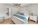 Bedroom with wood floors, ceiling fan, and adjoining closet at 5207 5Th Avenue Nw Dr, Bradenton, FL 34209