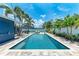 Backyard pool with lounge chairs, palm trees and patio at 5207 5Th Avenue Nw Dr, Bradenton, FL 34209