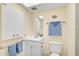 Bathroom featuring a vanity with storage, a mirror, and blue towels at 708 Tamiami S Trl # 115, Venice, FL 34285