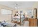 Comfortable bedroom with beach-themed decor and furnishings, offering a relaxing and inviting space at 708 Tamiami S Trl # 115, Venice, FL 34285