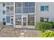 Apartment exterior with screened in balconies at 708 Tamiami S Trl # 115, Venice, FL 34285
