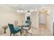 Cozy dining area featuring a glass table and stylish chairs, ideal for entertaining at 708 Tamiami S Trl # 115, Venice, FL 34285