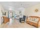 Cozy living room featuring a comfortable seating arrangement and bright, airy ambiance at 708 Tamiami S Trl # 115, Venice, FL 34285