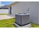 Image of AC unit on a concrete slab in the backyard at 711 Brenton Leaf Dr, Ruskin, FL 33570