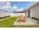 The backyard features a grassy lawn and a patio set at 711 Brenton Leaf Dr, Ruskin, FL 33570