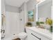 Clean and modern bathroom with a shower, vanity with a lighted mirror, and stylish fixtures at 711 Brenton Leaf Dr, Ruskin, FL 33570