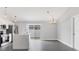 Kitchen view featuring stainless steel appliances, a marble island and hanging pendant lights at 711 Brenton Leaf Dr, Ruskin, FL 33570