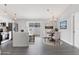 Modern kitchen with stainless steel appliances, center island, and dining area with sliding glass doors at 711 Brenton Leaf Dr, Ruskin, FL 33570