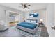 Comfortable bedroom featuring a sliding glass door and a serene ambiance, perfect for relaxation at 711 Brenton Leaf Dr, Ruskin, FL 33570