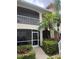 Two story exterior elevation with a screened in entry way and screened in balcony at 7201 L Pavia Blvd # 7201, Venice, FL 34292