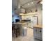 Kitchen with white appliances and breakfast bar at 7201 L Pavia Blvd # 7201, Venice, FL 34292