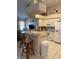 Kitchen with breakfast bar and white appliances at 7201 L Pavia Blvd # 7201, Venice, FL 34292