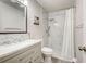 Modern bathroom featuring a marble tiled shower, contemporary fixtures, and stylish vanity at 7505 Wexford St, North Port, FL 34287