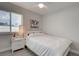 Cozy bedroom features a ceiling fan, a single bed, and a bright window at 7505 Wexford St, North Port, FL 34287