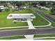 Charming single Gathering home featuring a well-manicured lawn and a pristine white fence surrounding the property at 7505 Wexford St, North Port, FL 34287