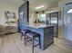 Contemporary kitchen with a wooden center island and stainless steel appliances at 7505 Wexford St, North Port, FL 34287