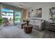 Cozy living room with comfortable seating and sliding glass doors to the patio at 7505 Wexford St, North Port, FL 34287