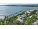 Waterfront home with docks, water access, mature trees, and lush landscaping at 755 Eagle Point Dr, Venice, FL 34285