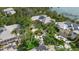 Beautiful home surrounded by mature, tropical trees with a circular driveway and plenty of parking at 755 Eagle Point Dr, Venice, FL 34285