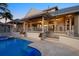 Beautiful backyard with a sparkling pool and inviting outdoor living space at 755 Eagle Point Dr, Venice, FL 34285