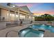 Inviting backyard features a pristine pool and spa with ample space for entertaining at 755 Eagle Point Dr, Venice, FL 34285