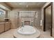 Stunning bathroom featuring a large soaking tub, tiled shower, and neutral color palette at 755 Eagle Point Dr, Venice, FL 34285