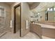 Well-designed bathroom featuring a vanity, sink, and walk-in shower at 755 Eagle Point Dr, Venice, FL 34285