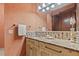 A bathroom vanity featuring unique tiling and ample counter space at 755 Eagle Point Dr, Venice, FL 34285