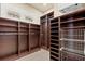 Spacious walk-in closet with custom shelving and ample storage space at 755 Eagle Point Dr, Venice, FL 34285