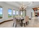 Bright dining room with waterfront views through large windows at 755 Eagle Point Dr, Venice, FL 34285