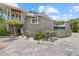 Outdoor pool area with lush landscaping, stone pavers, and beautiful palm trees at 755 Eagle Point Dr, Venice, FL 34285