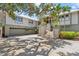 Beautiful two-story home featuring an attached three-car garage and grand entrance stairs with lush landscaping at 755 Eagle Point Dr, Venice, FL 34285