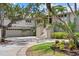 Beautiful two-story home featuring an attached three-car garage and grand entrance stairs with lush landscaping at 755 Eagle Point Dr, Venice, FL 34285
