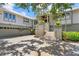 Beautiful two-story home featuring an attached three-car garage and grand entrance stairs with lush landscaping at 755 Eagle Point Dr, Venice, FL 34285