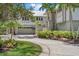 Beautiful two-story home featuring an attached three-car garage and grand entrance stairs with lush landscaping at 755 Eagle Point Dr, Venice, FL 34285
