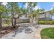 Beautiful two-story home featuring an attached three-car garage and grand entrance stairs with lush landscaping at 755 Eagle Point Dr, Venice, FL 34285