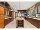 Gourmet kitchen with a center island, custom cabinets, and stainless steel appliances at 755 Eagle Point Dr, Venice, FL 34285