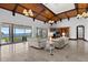Spacious living room with elegant vaulted wood ceilings and amazing water views at 755 Eagle Point Dr, Venice, FL 34285