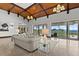 Bright living room with coffered ceiling, water views, and an open floor plan at 755 Eagle Point Dr, Venice, FL 34285