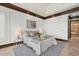 Comfortable main bedroom with a tray ceiling and decorative trim at 755 Eagle Point Dr, Venice, FL 34285