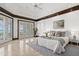 Bright main bedroom with waterfront views and tray ceiling at 755 Eagle Point Dr, Venice, FL 34285