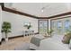 Luxurious main bedroom with waterfront views and tray ceiling at 755 Eagle Point Dr, Venice, FL 34285