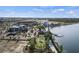 Aerial view showcasing a lakefront community park, playground, and recreational amenities at 7582 Lyncrest St, North Port, FL 34287