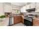 Modern kitchen with stainless steel appliances, stylish countertops, and ample storage, providing a functional and appealing space at 7582 Lyncrest St, North Port, FL 34287