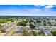 Overhead shot of the community, highlighting the mix of homes, tree coverage, and street layout at 7582 Lyncrest St, North Port, FL 34287