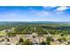 Expansive aerial image showing a community with mature landscapes, residential buildings, and roadways at 7582 Lyncrest St, North Port, FL 34287