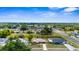 Aerial view of a well-established neighborhood with tree-lined streets and neatly kept homes at 7582 Lyncrest St, North Port, FL 34287