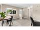 Flexible office space with a modern desk setup, natural light, and tile flooring offering versatility for work or study at 7582 Lyncrest St, North Port, FL 34287